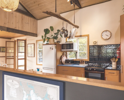 Cooking area: A perspective from the kitchen looking out over cooking area (electric stove top, grill, and oven.